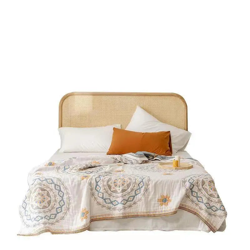 Cotton geometric patterned towel blanket laid flat, showing modern simplicity design.