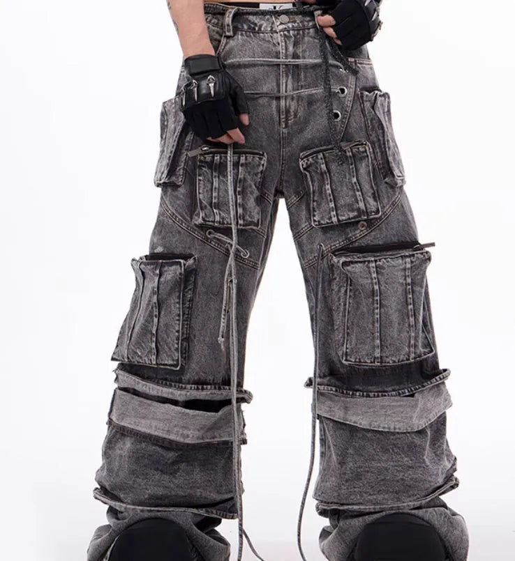 Grey distressed denim mop pants overalls with rope stitching detail on a hanger