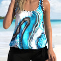 Blue tie-dye literary pattern women's plus size two-piece swimsuit, showing top and shorts on a hanger.