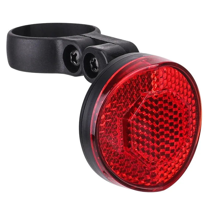 Red plastic anti-theft bicycle taillight bracket mounted on seat post with reflective surface