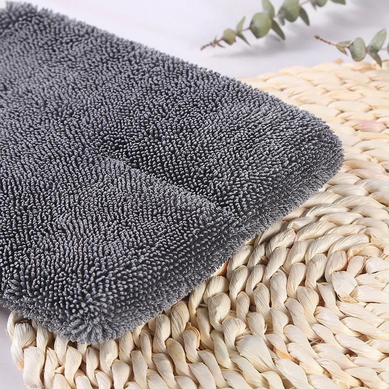 Pair of grey microfibre car cleaning gloves, 16cm x 26cm, with twisted braid spiral hair texture