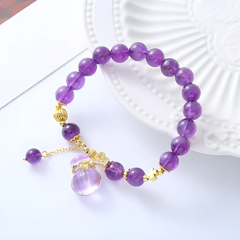 Purple amethyst crystal bracelet with geometric beads showing money bag charm and peace buckle pendant options