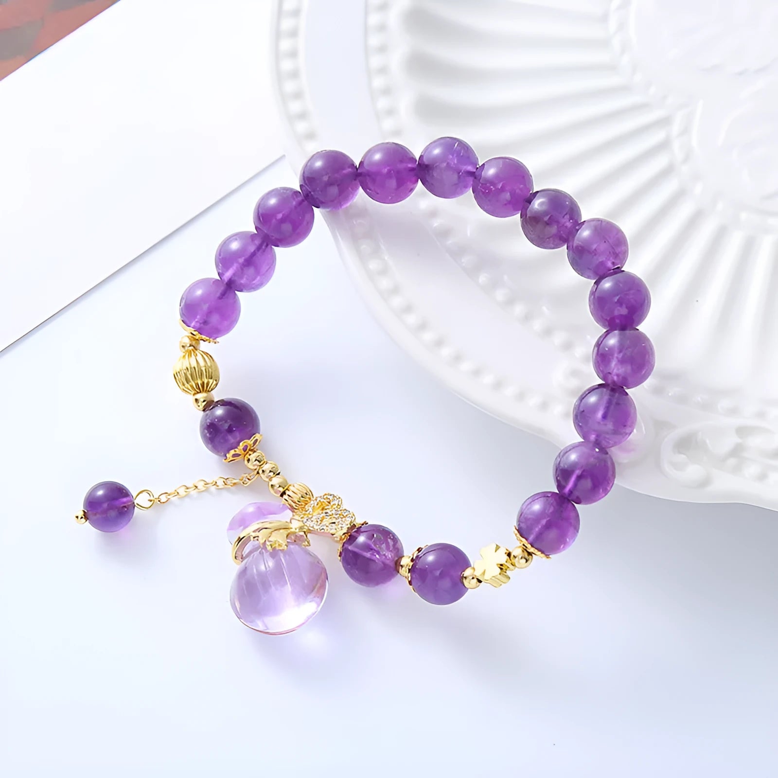 Purple amethyst crystal bracelet with geometric beads showing money bag charm and peace buckle pendant options