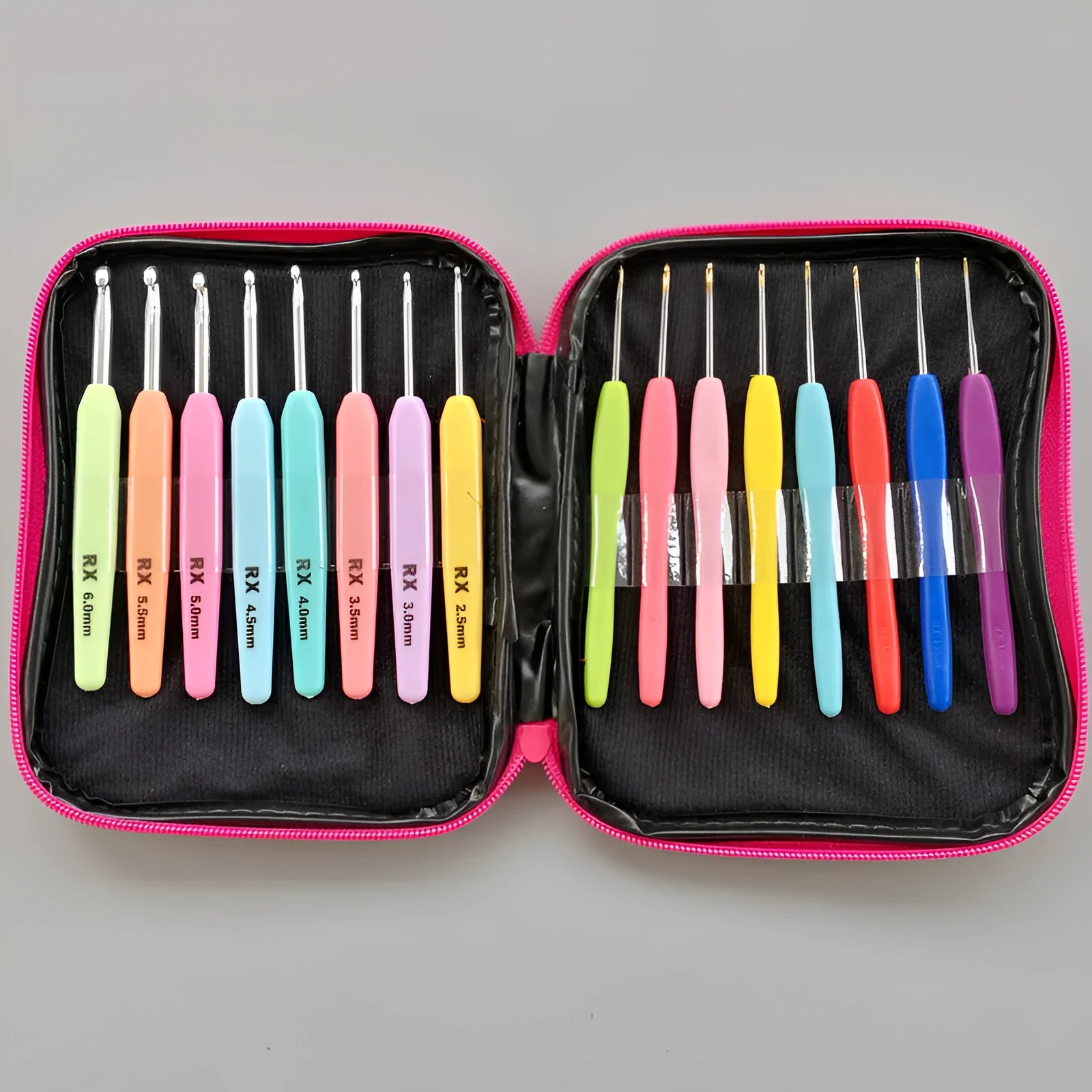 Set of 16 coloured crochet hooks with two handle types laid next to a grey PU fabric storage bag.