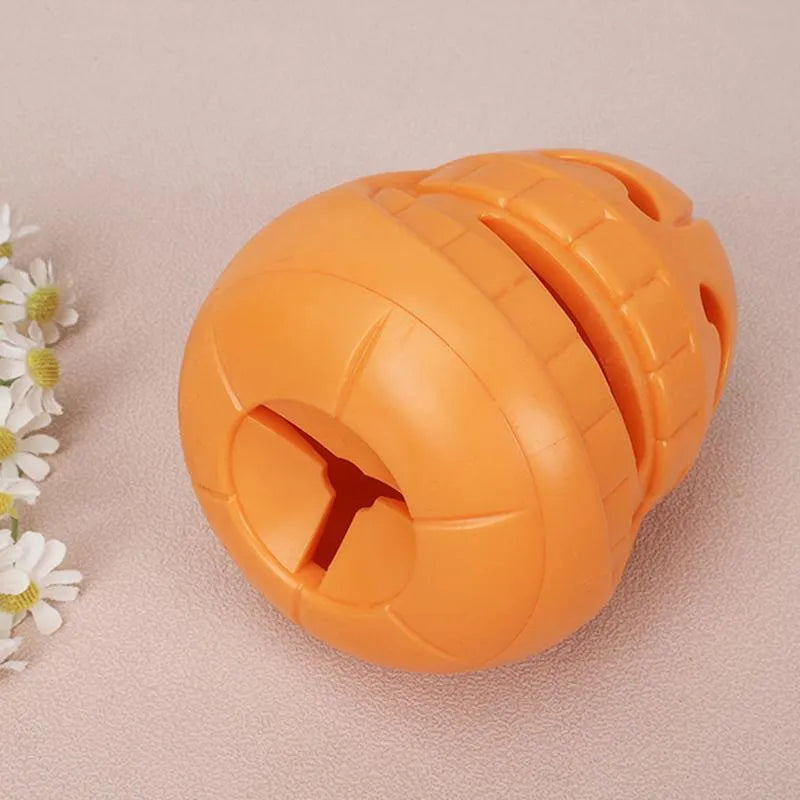 Yellow pumpkin-shaped dog chew toy made from TPR material measuring 8.6x11.5cm