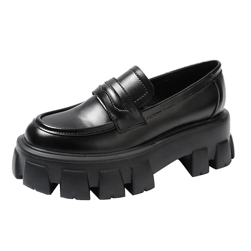British style wide fit patent leather loafers with a muffin heel and rubber sole.