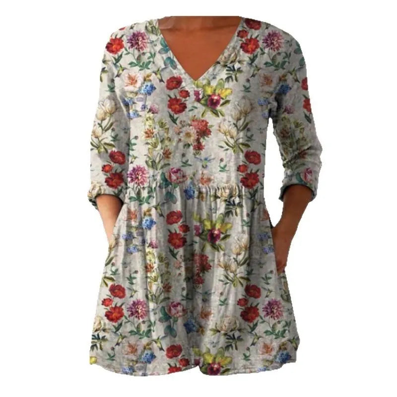 Women's printed loose dress with wide waist and 3/4 ruffle sleeves in a floral wave pattern.