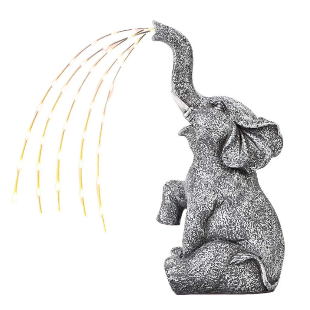 Grey resin elephant garden statue with textured finish and integrated LED lighting, 60cm tall.
