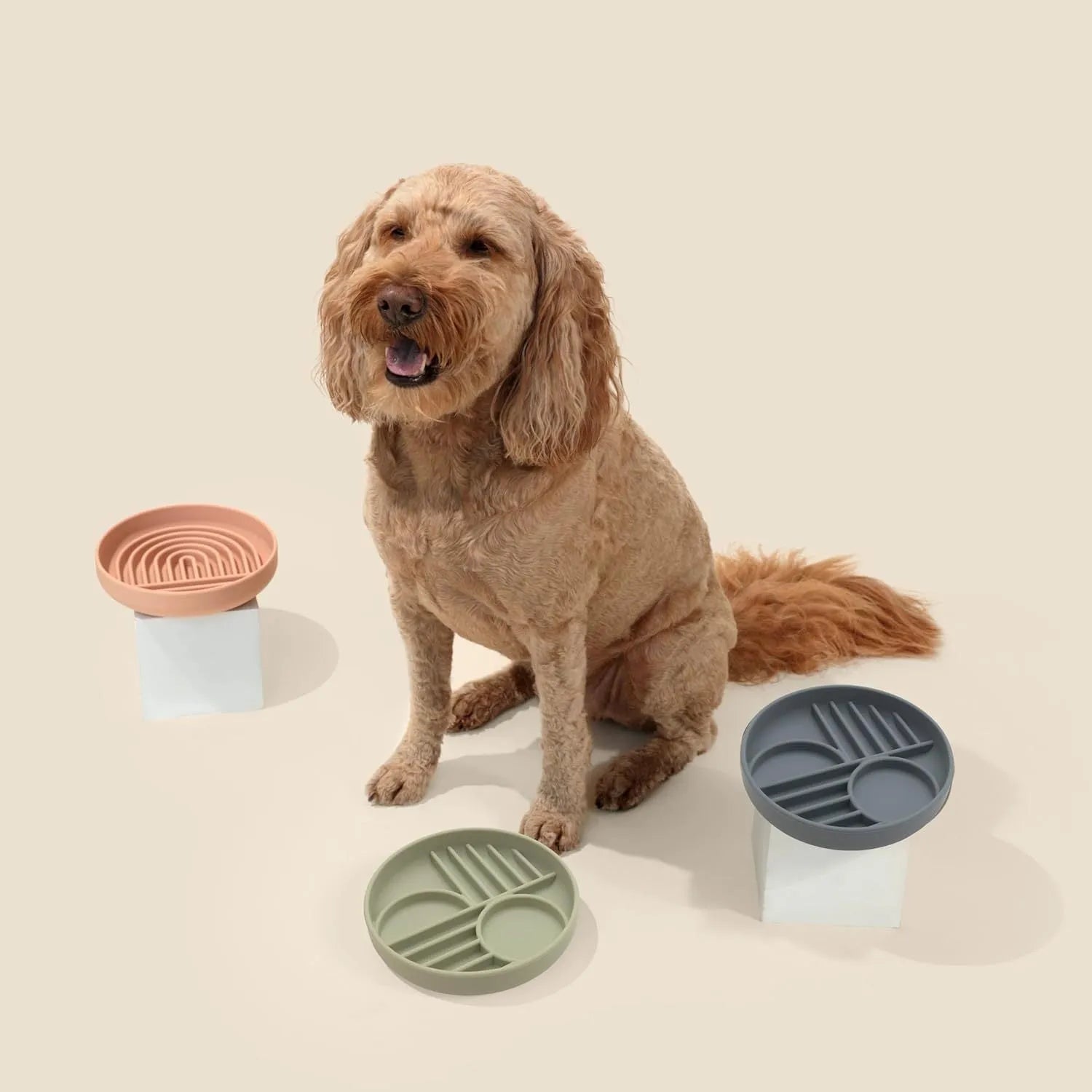 Silicone slow feeder dog bowl with textured ridges, shown in beige colour on a wooden surface.