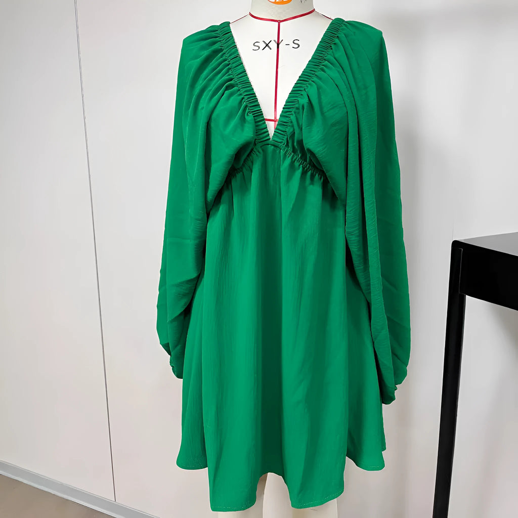 Solid colour V-neck dress with long puff sleeves and a mid-waist swing skirt.