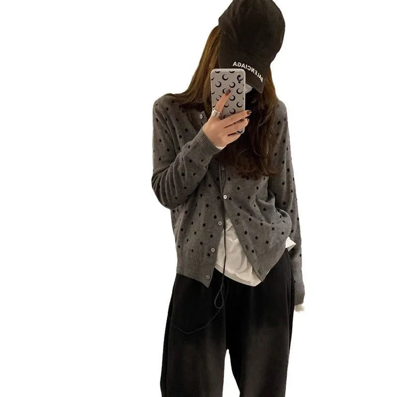 Grey dot crochet pattern on a loose-fit black women's viscose knitted cardigan.