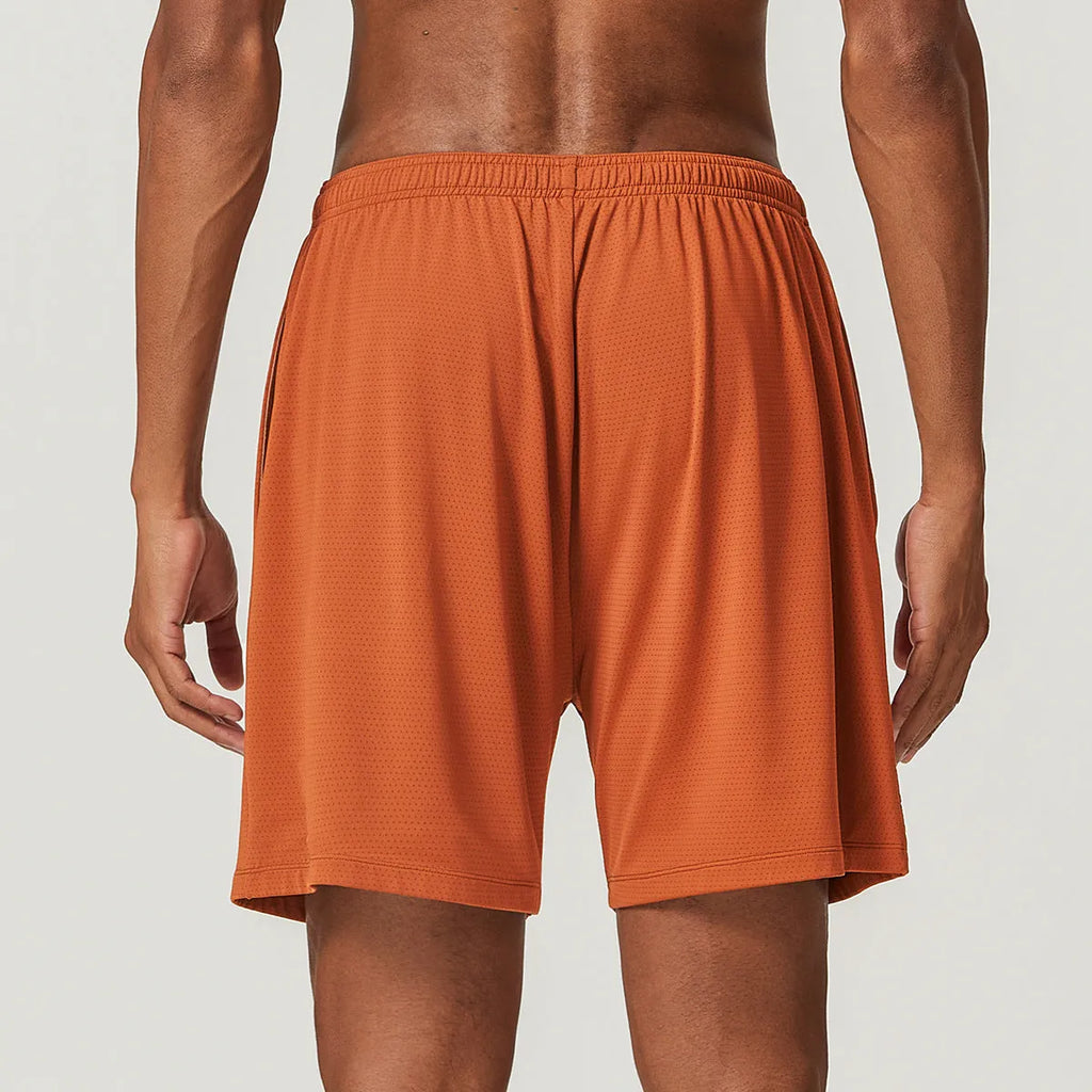 Men's quick-drying double-layer running shorts in khaki colour on a mid-waist model.
