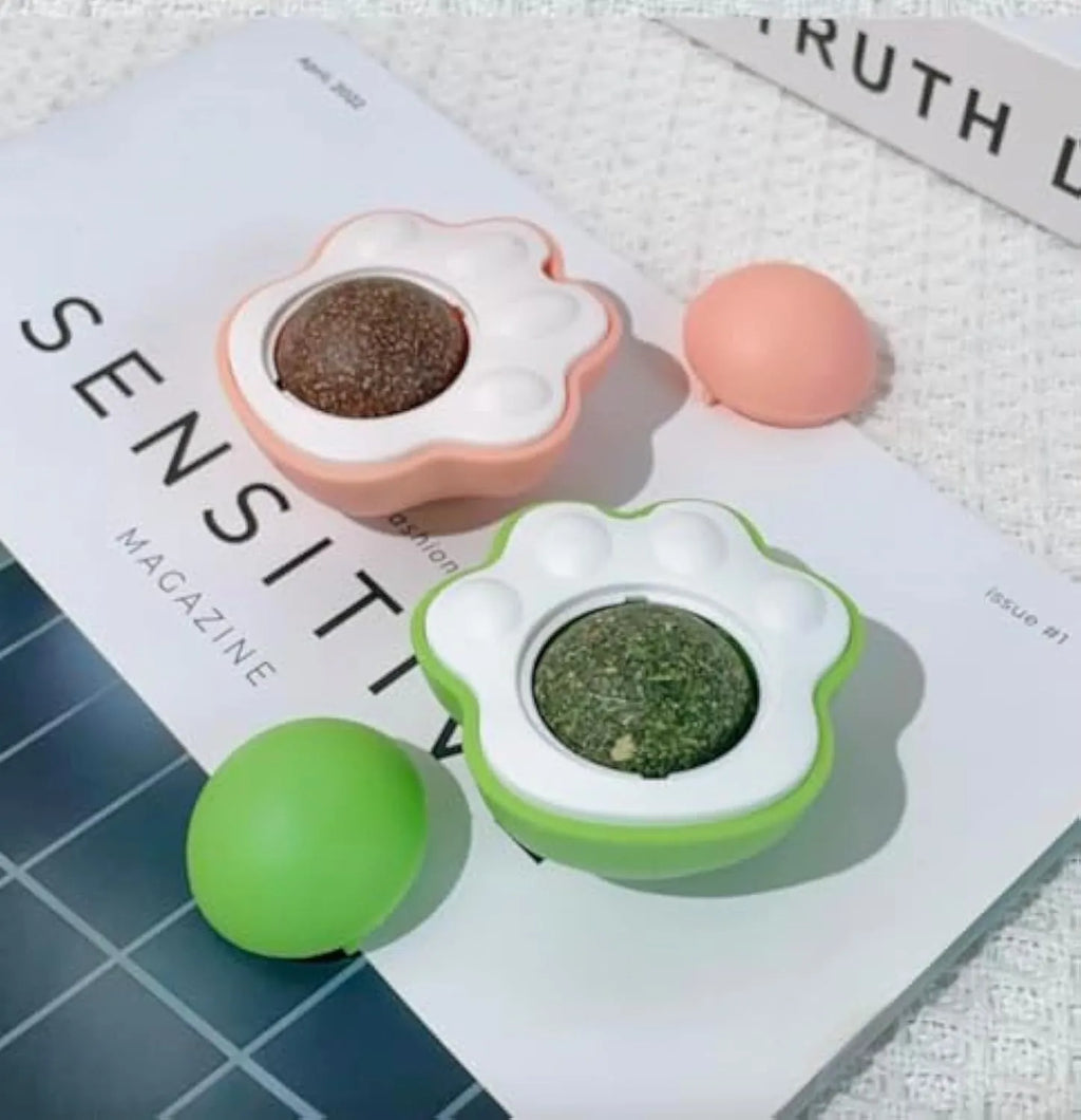 Blue, green, and pink edible vine catnip balls for cats, shown as dental chew and play toys.
