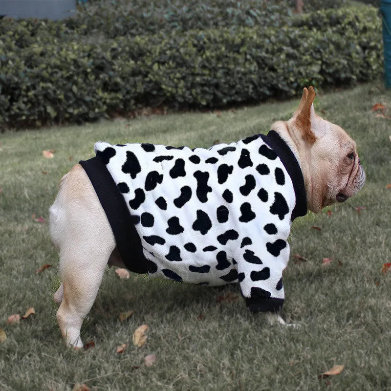 Female corgi wearing winter dog pajamas in coral fleece with plain pattern, showing bear style colour, side view