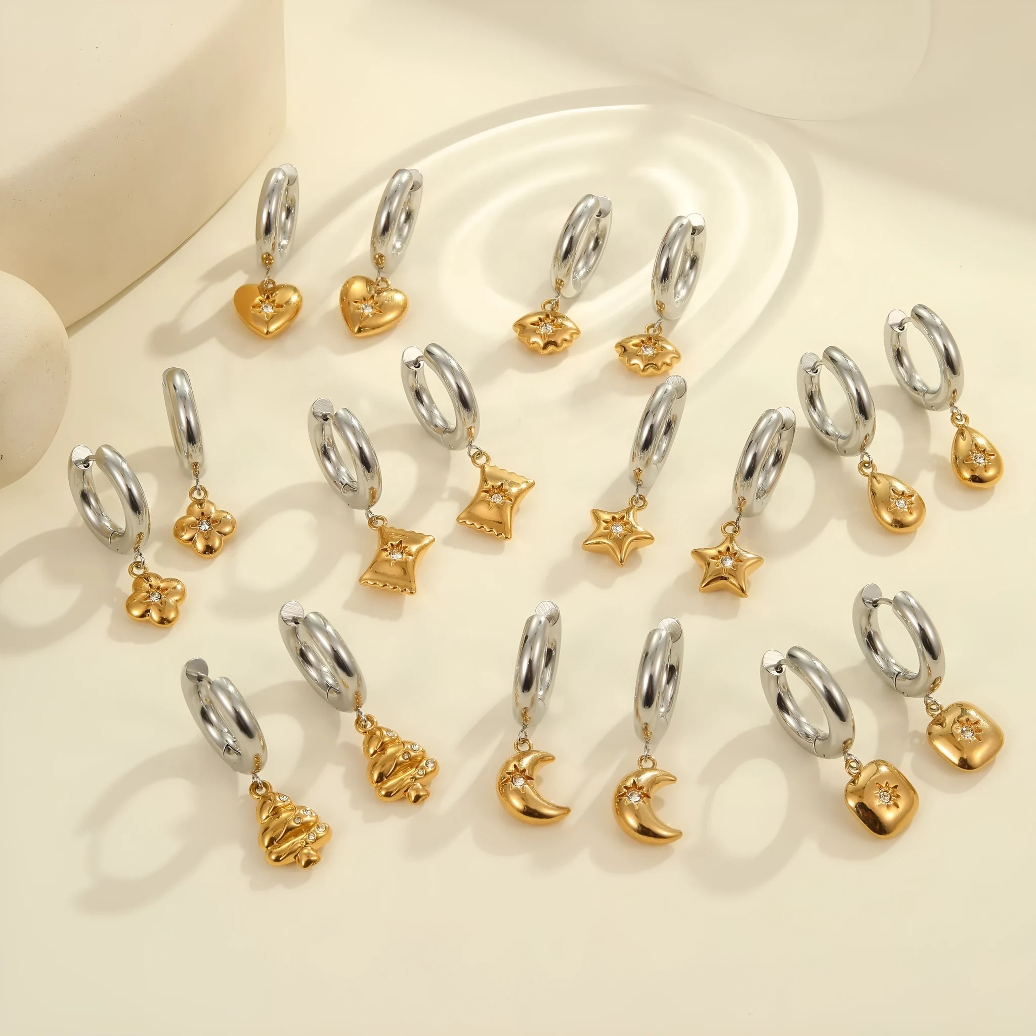 Stainless steel Christmas tree heart earrings with electroplated 18K gold finish showing heart and star shapes