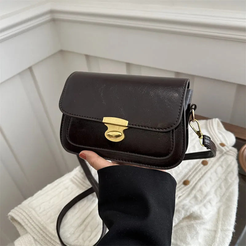 Retro square PU handbag in soft textured leather showing horizontal orientation and neutral colour options