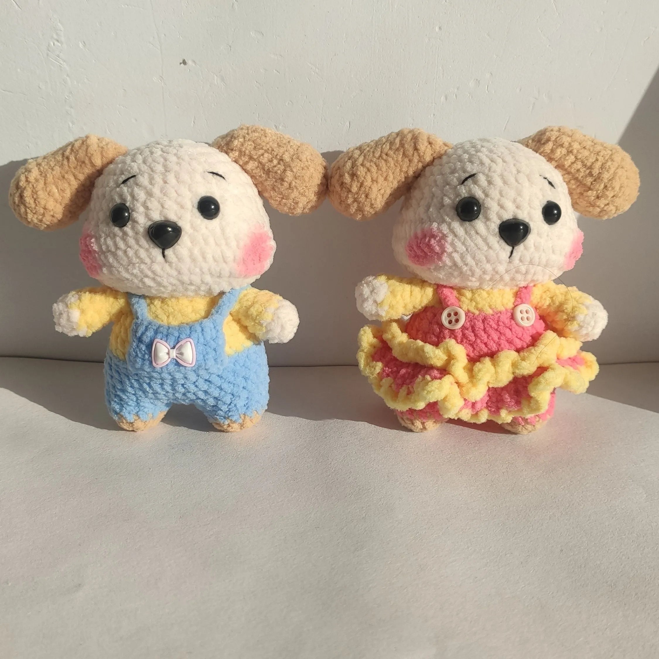 Handmade woollen zodiac dog pendant charm on a keychain, shown in pinafore dress style.