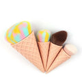 Four-piece makeup brush set with artificial fibre bristles and plastic handles in a paper box