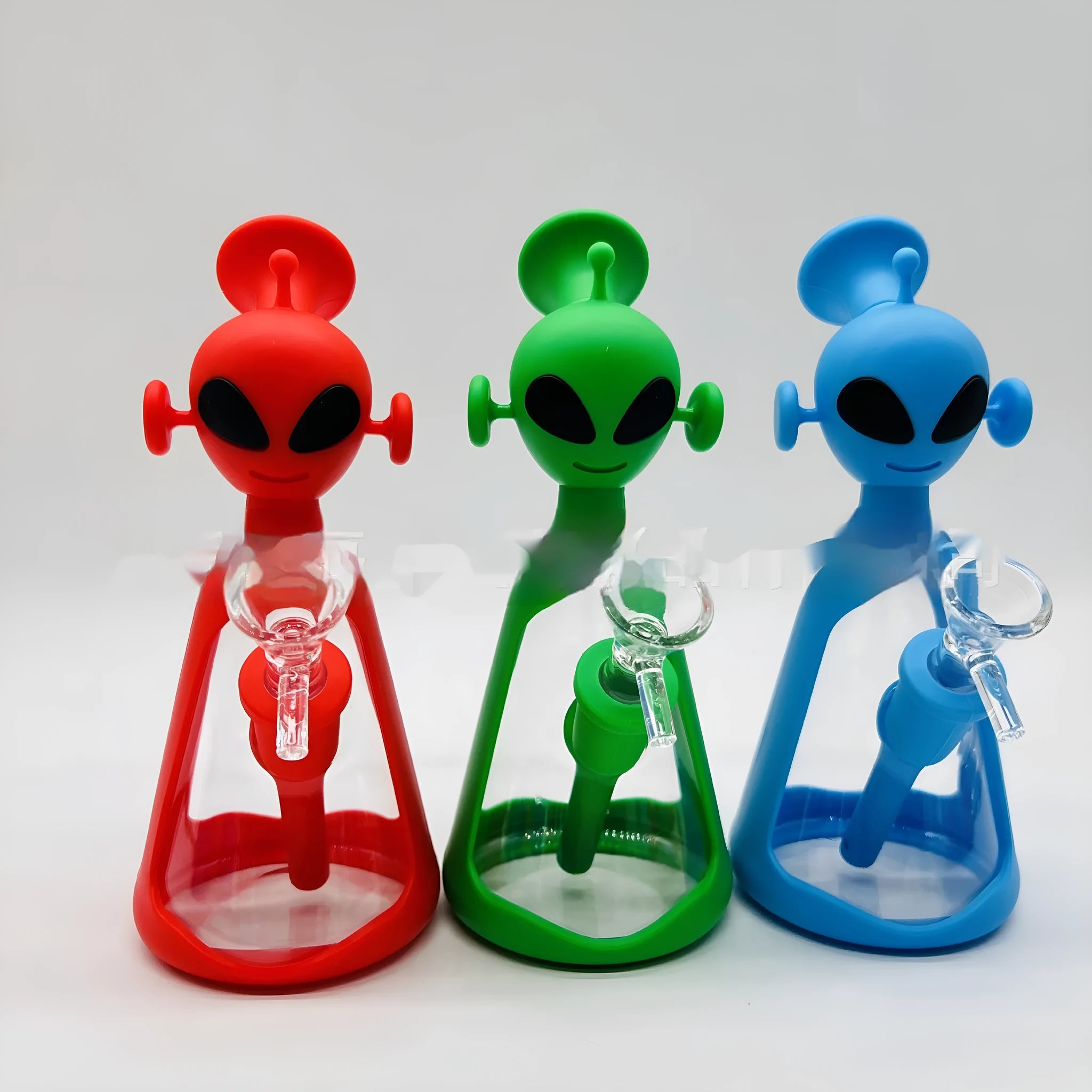 Glass silicone cigarette pipe with clear bowl and blue silicone mouthpiece on white background