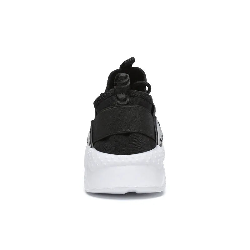 Women's lightweight mesh sports shoes with flat heel and round toe in black and white colour