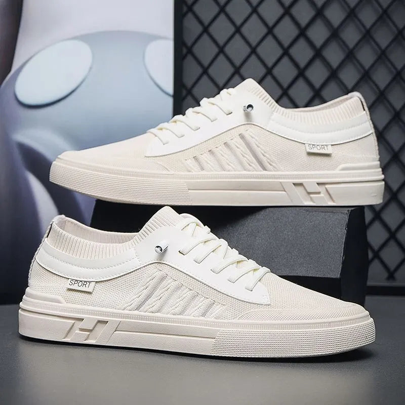 Men's low-top casual shoes in grey with mesh lining, flat plastic sole, and sewing thread detail