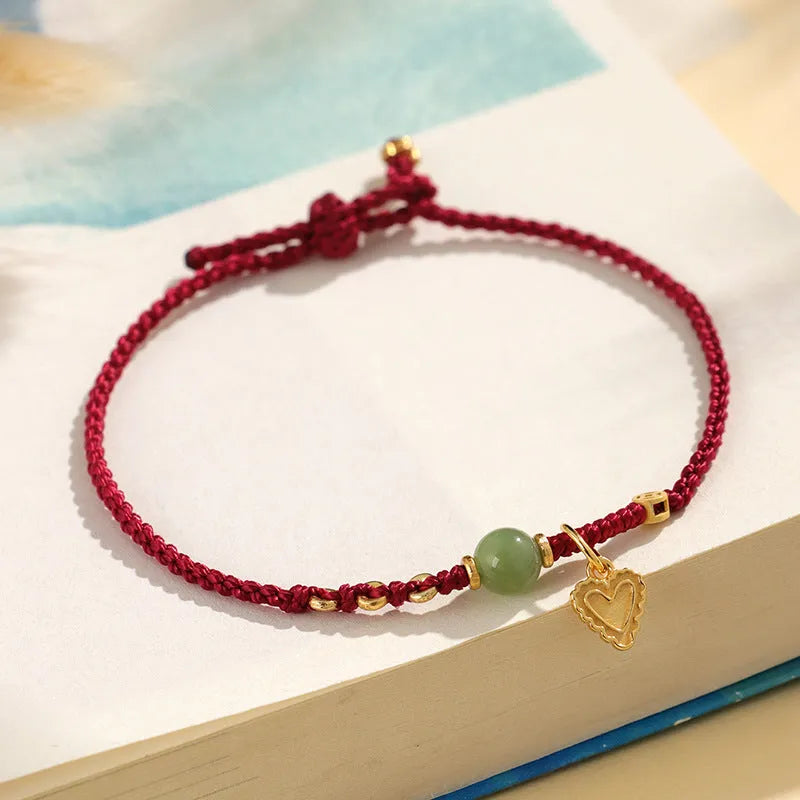 Handmade women's 925 silver and Hetian jade woven bracelet with red carrying strap