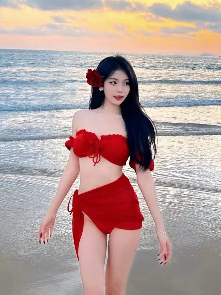 Red women's bikini swimsuit with puff sleeve skirt top and matching briefs