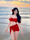 Red women's bikini swimsuit with puff sleeve skirt top and matching briefs