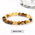 Natural yellow tiger's eye crystal bracelet with mixed yellow tower charms on wrist
