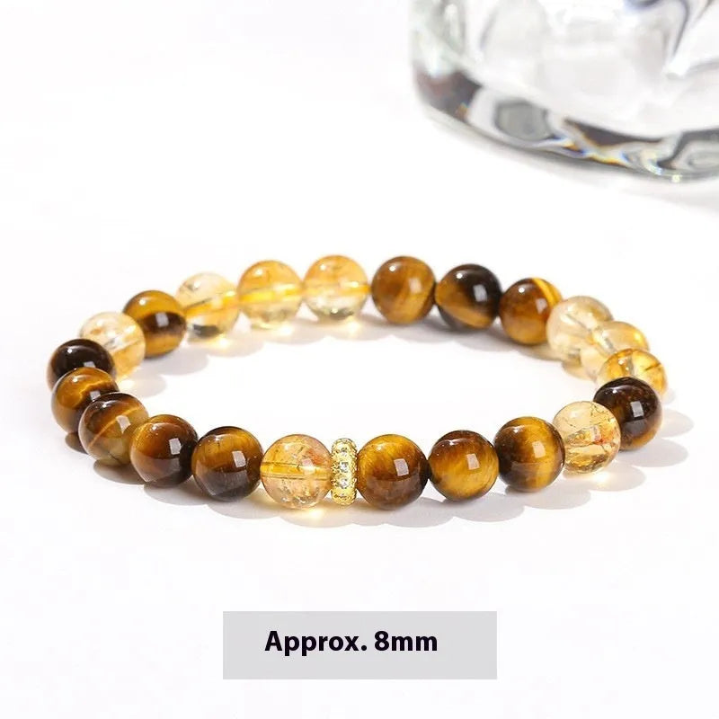 Natural yellow tiger's eye crystal bracelet with mixed yellow tower charms on wrist