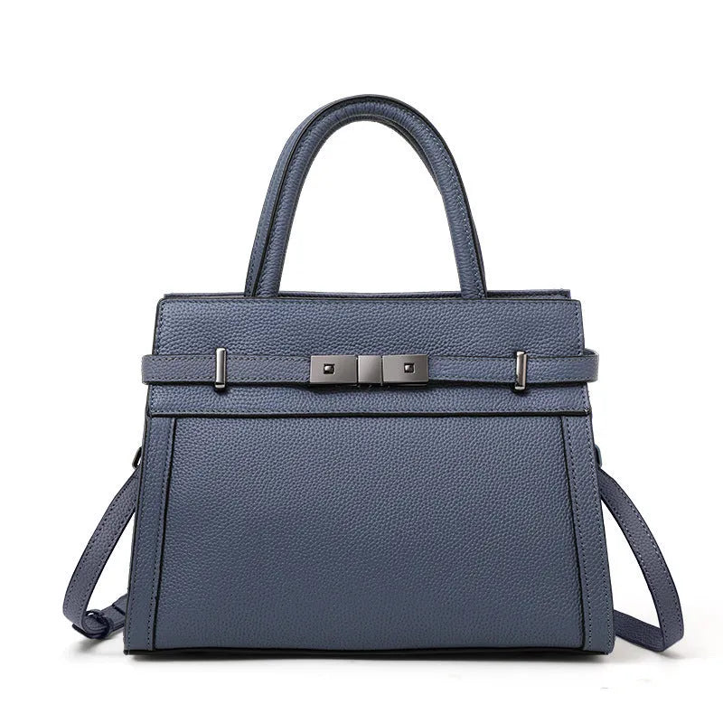 Genuine leather women's crossbody bag in clamshell design with multiple internal pockets