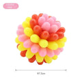 Multicolour durable rubber dog teething ball in red yellow and teal for dental cleaning and interactive play