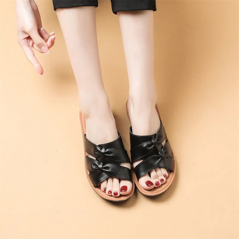 Solid colour cowhide slippers for women with soft non-slip soles in beige, black, and red options