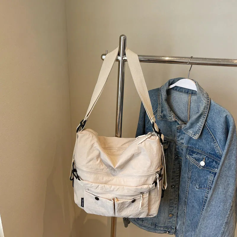 Women's soft nylon crossbody bag in square vertical shape with dual shoulder straps