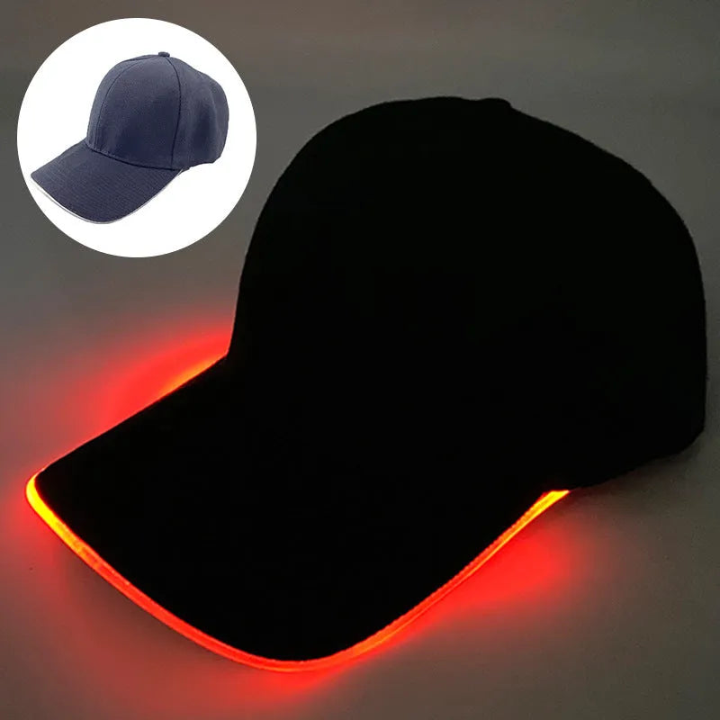 Black Halloween baseball cap with LED pumpkin smile face and yellow lights illuminated.