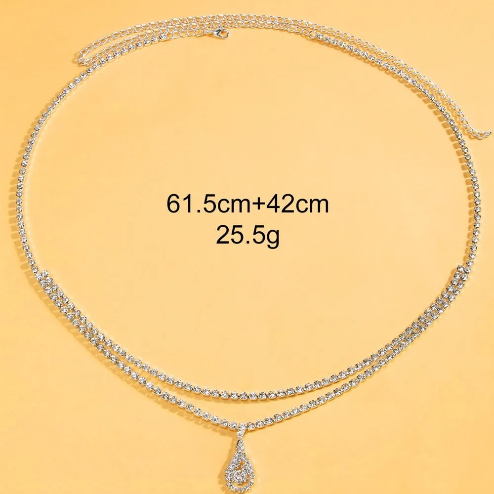 Gold or silver rhinestone waist chain with a water drop pendant and tassel detail