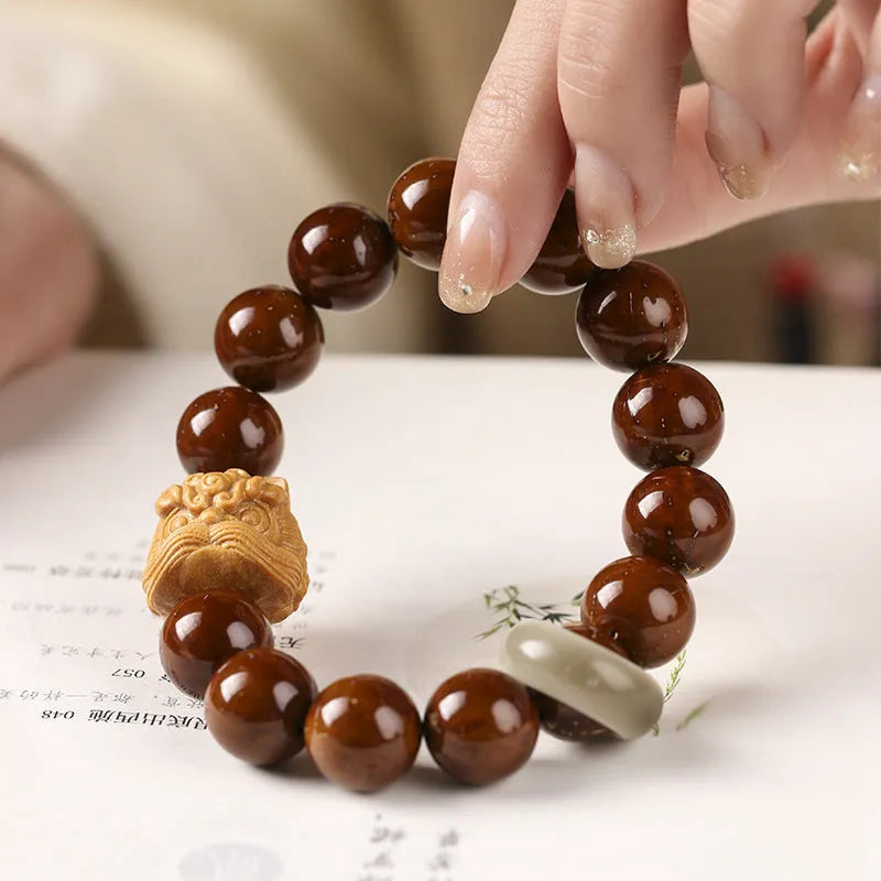 Hand-woven Buddhist prayer bracelet with 13mm round beads in ivory nut, bodhi, or sandalwood lion style