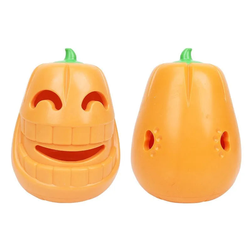Orange Halloween pumpkin-shaped dog chew toy with a treat-dispensing funnel hole.