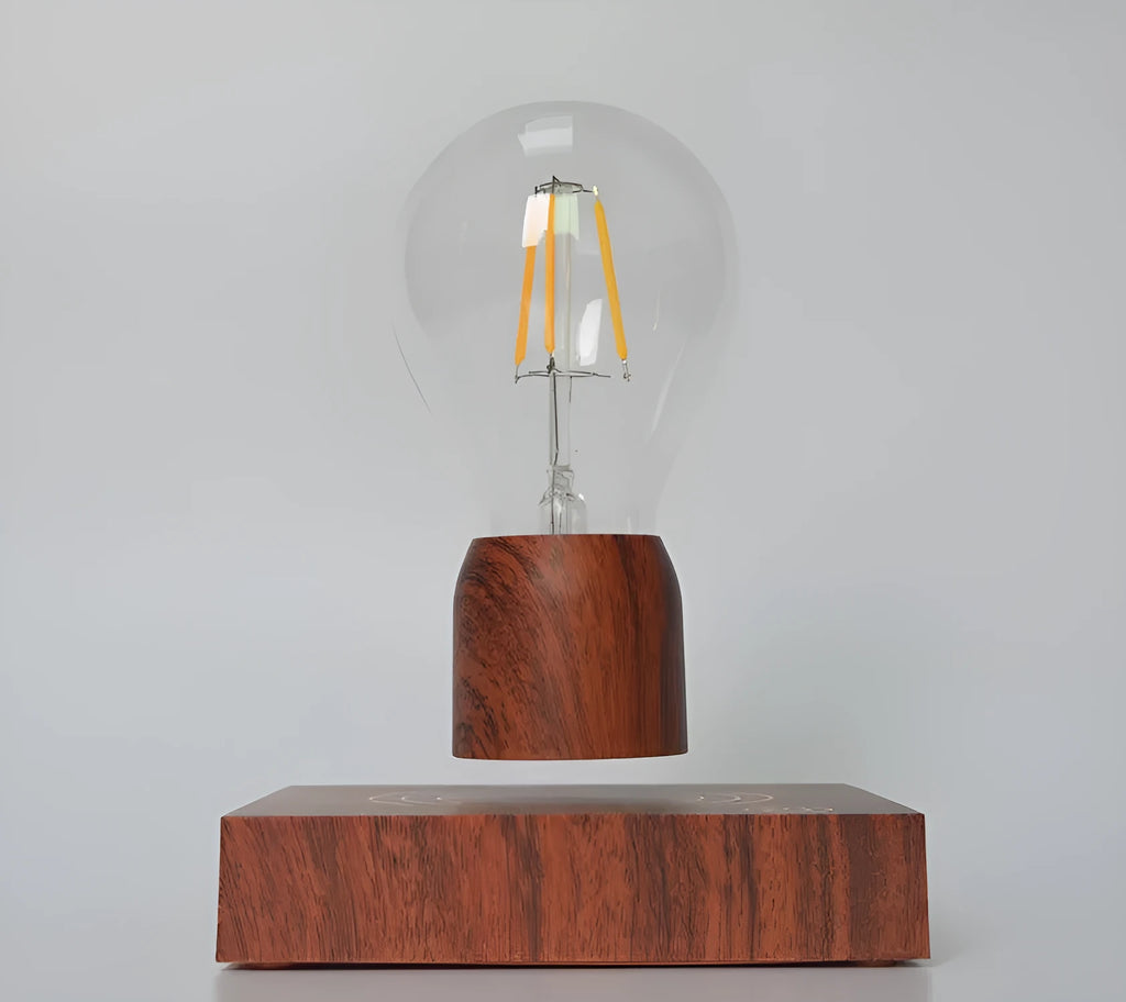 Magnetic levitation floating light bulb with imitation wood base on a table.