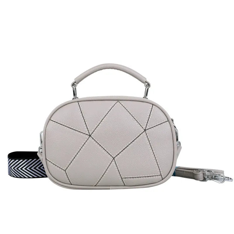 Three-layer retro patchwork small bag in round suitcase shape with stitching detail