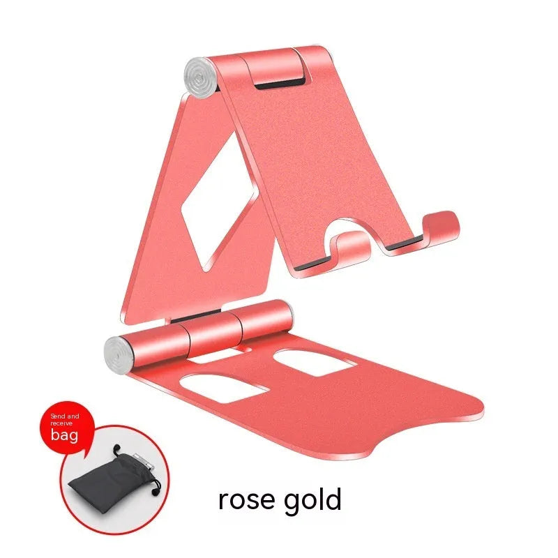 Aluminium alloy mobile desktop stand folding bracket in silver on a desk with a smartphone