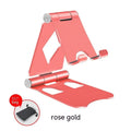 Aluminium alloy mobile desktop stand folding bracket in silver on a desk with a smartphone