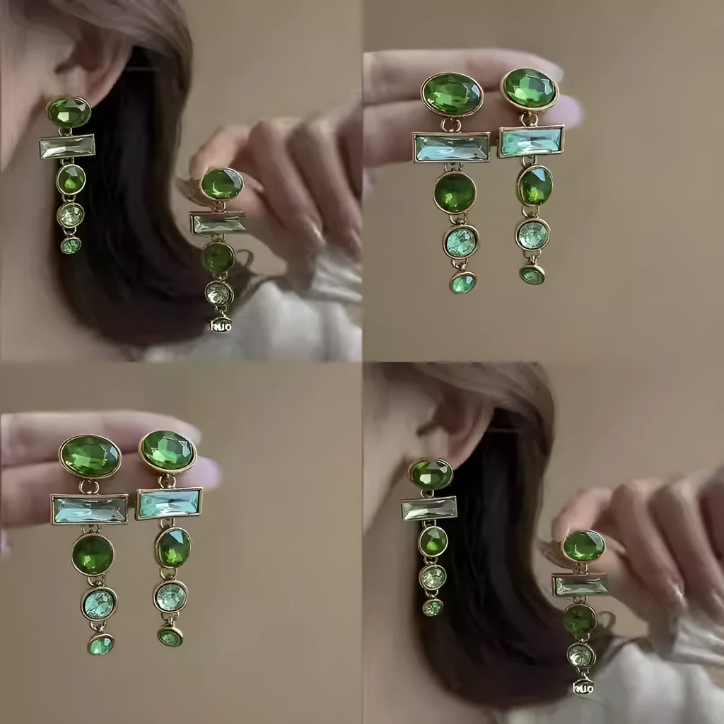 Pair of green gradient geometric ear studs with zircon details and a long tassel, on a white background.