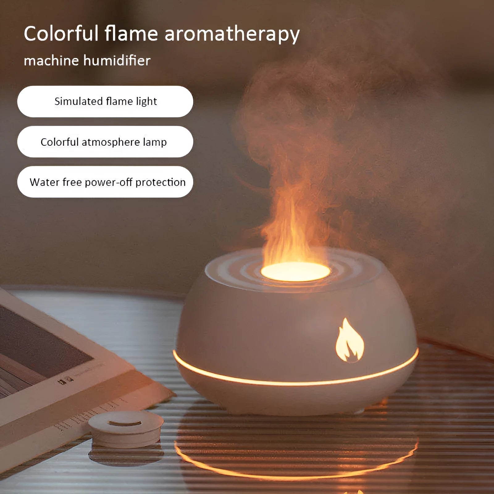 Black and white USB humidifier diffuser with glowing flame effect light on a wooden table.