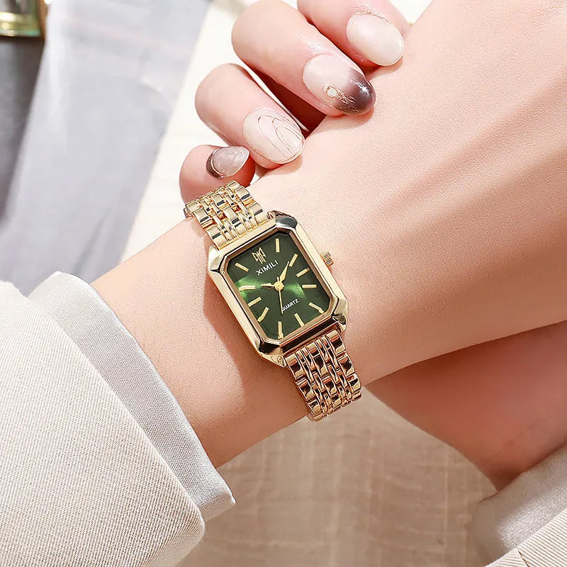 Simple square women's watch with alloy strap, quartz movement, and silver case on a white background