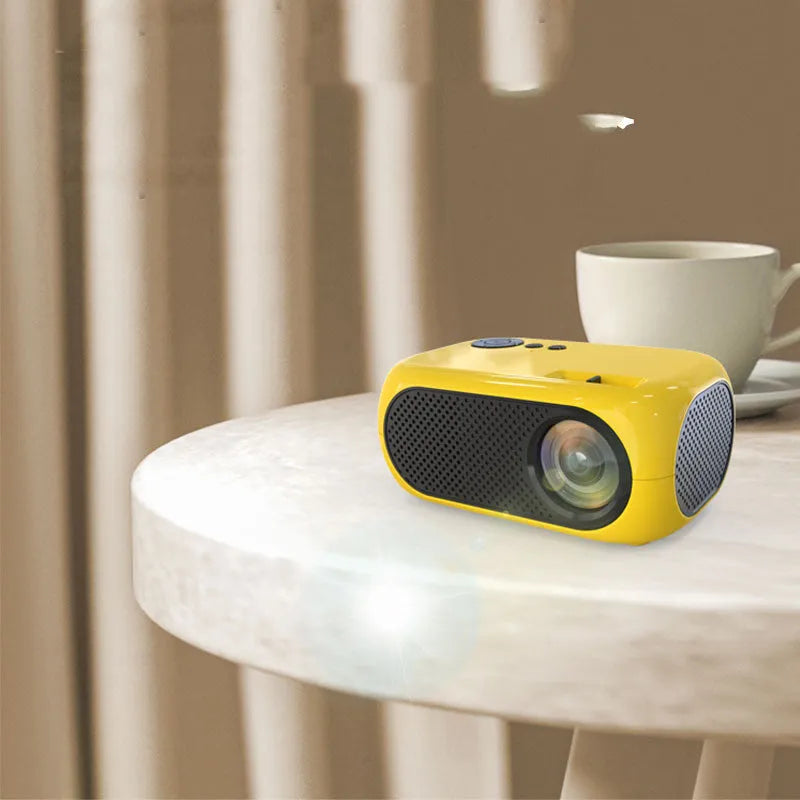 M24 micro mini portable LED projector in gold or white colour with power adapter and cables.