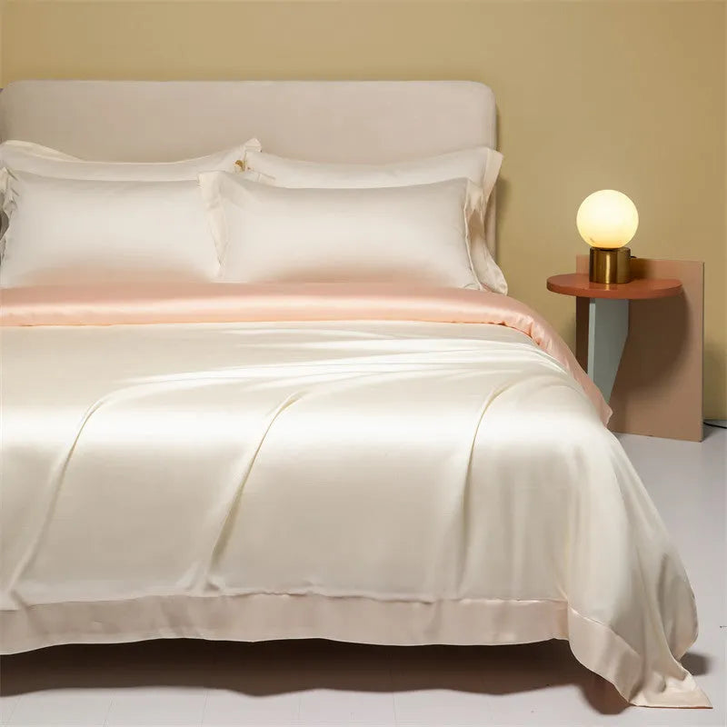 Lenzing Tencel quilt cover and pillowcase set in Aurora Blue, neatly arranged on a bed.