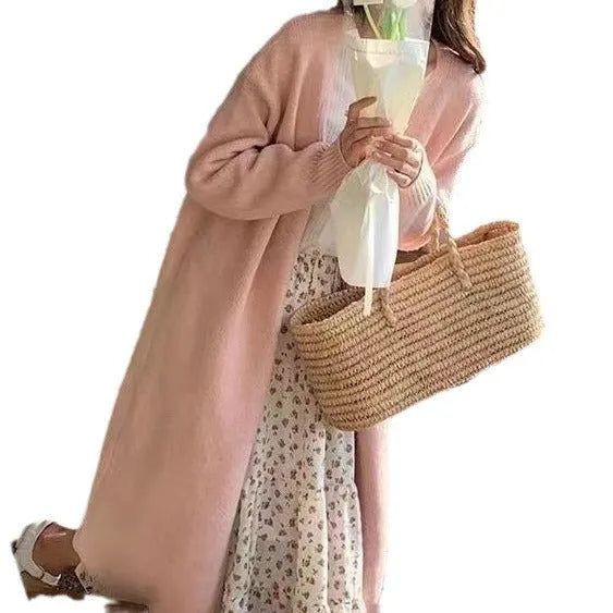 Women's loose fit V-neck knitted cardigan in a mid-length style, shown in a choice of colours.
