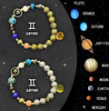 Set of two natural stone beaded bracelets with Chinese zodiac animal symbols on a background.
