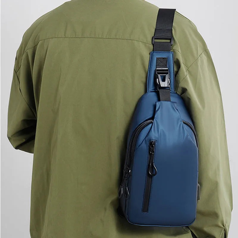 Black sling crossbody backpack for men with zip closure and soft handle, solid colour